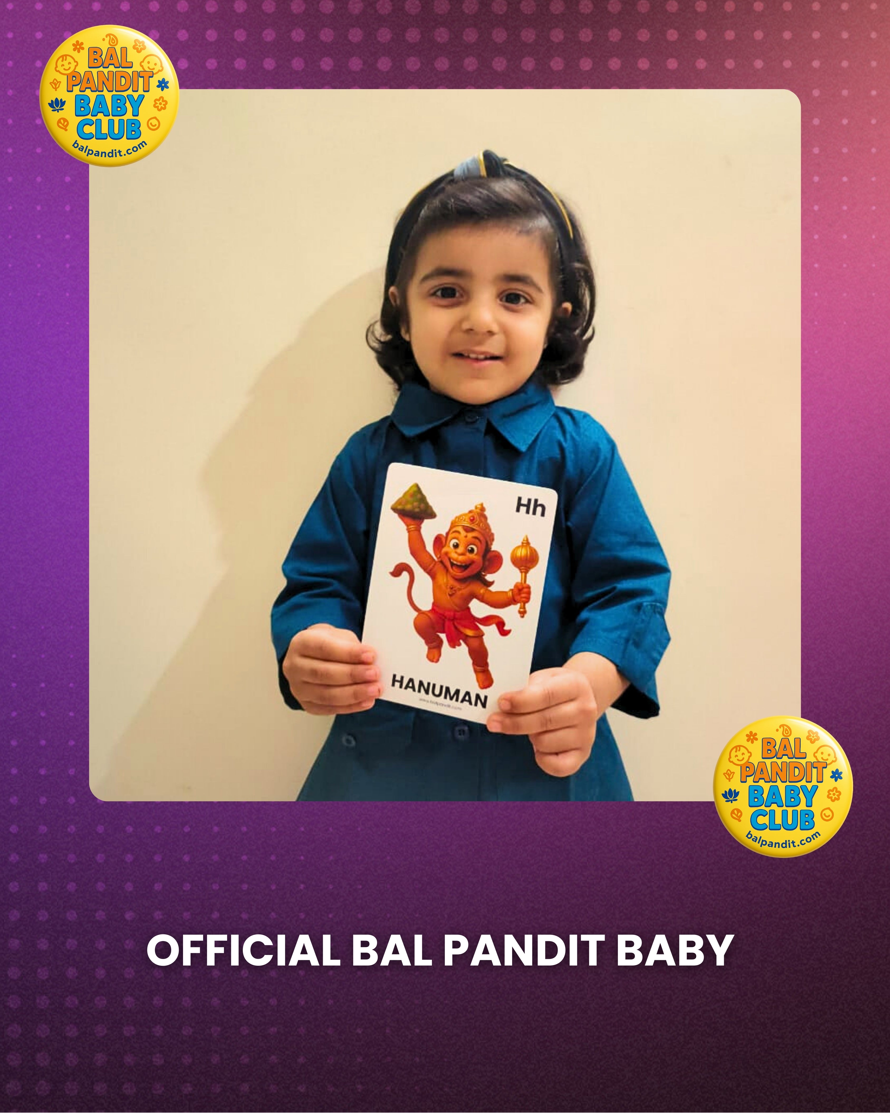 A young Bal Pandit learner holding a Hanuman alphabet flashcard